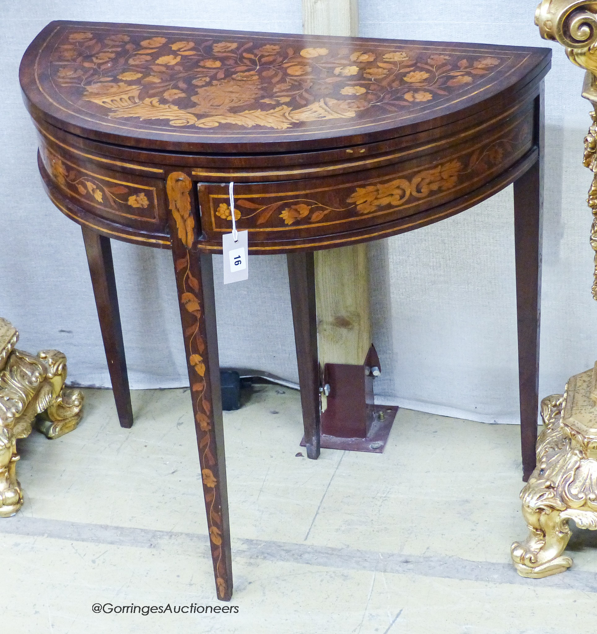 An early 19th century Dutch floral marquetry walnut D shaped folding card table, width 80cm, depth 45cm, height 76cm